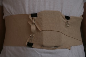 Tucked device covered by bandage